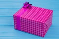 Big purple checkered gift box.