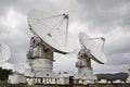 Big radio telescope on cloudy sky background Royalty Free Stock Photo