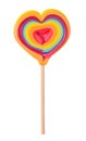 Big rainbow pride lollipop heart shaped candy love symbol on wooden stick isolated Royalty Free Stock Photo