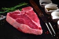 Raw porterhouse steak on a dark wood Royalty Free Stock Photo