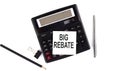 BIG REBATE text on sticker on calculator with pen,pencil on the white background