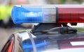 big red and blue flashing lights on the police car during the re Royalty Free Stock Photo