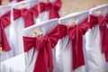 Big Red Bows on Wedding Chairs Royalty Free Stock Photo