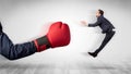 Red boxing glove knocks out little businessman