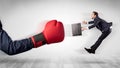 Red boxing glove knocks out little businessman