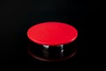 Big red button on a black background. The concept of the use of nuclear, biological or chemical weapons