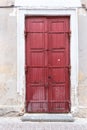 Big red front door. Destroyed building wall Royalty Free Stock Photo