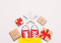 Big red gumshoes in cool shopping bag, star shaped toy Royalty Free Stock Photo