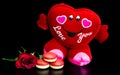 Big red heart on black background with red roses Royalty Free Stock Photo