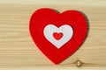 Big red heart of soft fabric, on wooden background. family, Valentine Day, Wedding Love Concept. Royalty Free Stock Photo