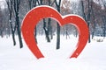 Big Red Heart street installation in winter park. Valentine's Day, love, romance background Royalty Free Stock Photo