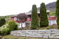 Big Red House with Rocky Wall and Garden Royalty Free Stock Photo