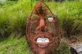 Big red iron face at garden