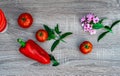 big red pepper, three red tomatoes, violet and mint, objective photography