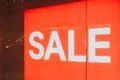 Big red SALE sign in the window of a clothing store Royalty Free Stock Photo