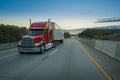 Big red semi truck on road