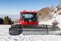 Big Red snowcat on the road in Kazakhstan Royalty Free Stock Photo