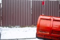 Big red snowplow bucket. Snow removal, road cleaning Royalty Free Stock Photo