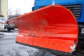 Big red snowplow bucket. Snow removal, road cleaning Royalty Free Stock Photo