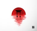 Big red sun and black sacred torii gates reflecting in water. Hieroglyph - clarity Royalty Free Stock Photo