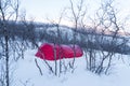 Big red tent in the middle of a snowy forest Royalty Free Stock Photo