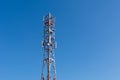 Tower with telecommunication antennas for mobile phone and and copy space on blue sky Royalty Free Stock Photo