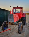 Big red tractor on the beach in Ahlbeck. Germany Royalty Free Stock Photo