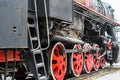 Big red wheels of a old train