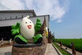 The big rice mascot in front of the Paddy Processing Factory & Gallery