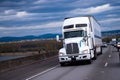 Big Rig American semi truck carring cargo on highway Royalty Free Stock Photo