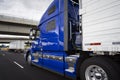 Big rig bright blue long haul semi truck transporting goods in r Royalty Free Stock Photo