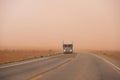 Big rig car hauler semi truck running on the Arizona road during Royalty Free Stock Photo