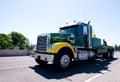 Big rig equipped towing semi truck on road Royalty Free Stock Photo