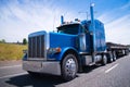 Big rig semi truck blue wolf of roads Royalty Free Stock Photo