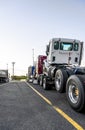 Big rig semi truck transporting another semi truck tractors shipped one on top of the other Royalty Free Stock Photo