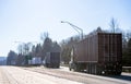 Big rigs semi trucks standing in line to weight station for check truck weight and axle weight distribution Royalty Free Stock Photo