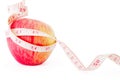 Big ripe red apple with measure tape Royalty Free Stock Photo