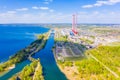 Big river flowing near local power station aerial landscape