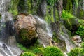 Big rock, moss and green plants in waterfall cliff Royalty Free Stock Photo