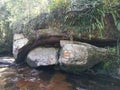 Big rock over the waterway. Royalty Free Stock Photo