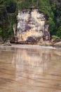 Big rock reflection from wet sand