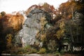 Big rock with rocks, mountains..lit by sunset. Landscape with forest, trees and stones. Autumn, yellow, red, green trees