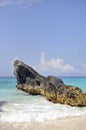 Big rock, turquoise sea and blue sky at Pink beach, Bermuda. Royalty Free Stock Photo