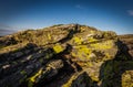 Big rock with yellow lichen on peak of Velky Keprnik with dark blue sky in Jeseniky Royalty Free Stock Photo