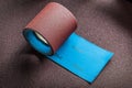 Big roll of abrasive paper on sandpaper sheet Royalty Free Stock Photo