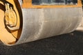 big roller and the black asphalt of the new road Royalty Free Stock Photo