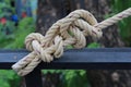 Big rope tied knot at wood Royalty Free Stock Photo