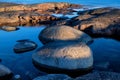 Big round rocks on the beach of sea. Royalty Free Stock Photo