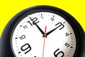 Big round wall clock isolated on yellow close-up Royalty Free Stock Photo