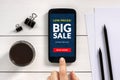 Big sale concept on smart phone screen with office objects Royalty Free Stock Photo